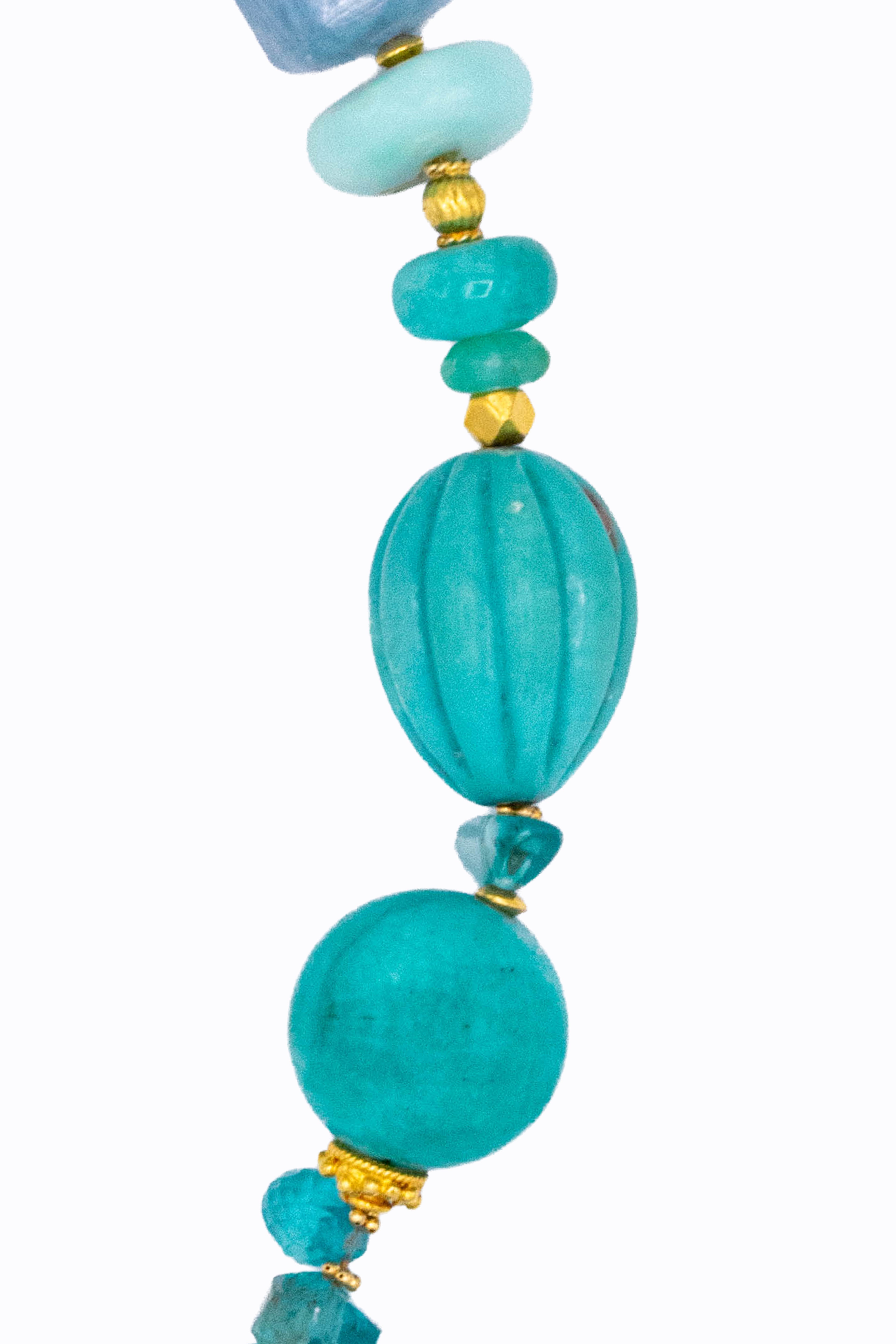 Bluey 14k bracelet close-up showing carved turquoise melon bead and fluorite with gold spacers by Alexandra Essex
