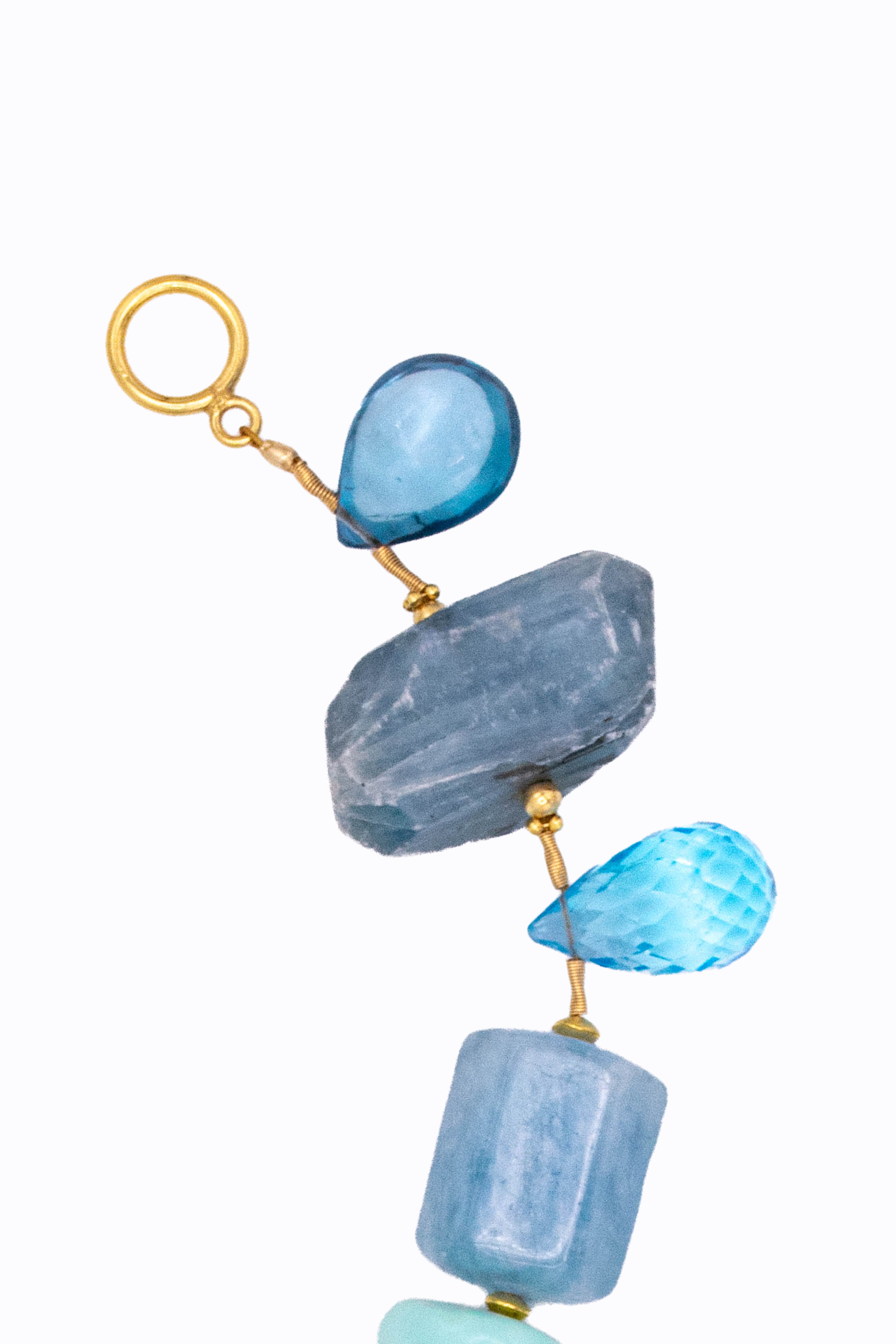 Bluey 14k bracelet detail showing aquamarine blue topaz and labradorite stones with gold toggle clasp by Alexandra Essex