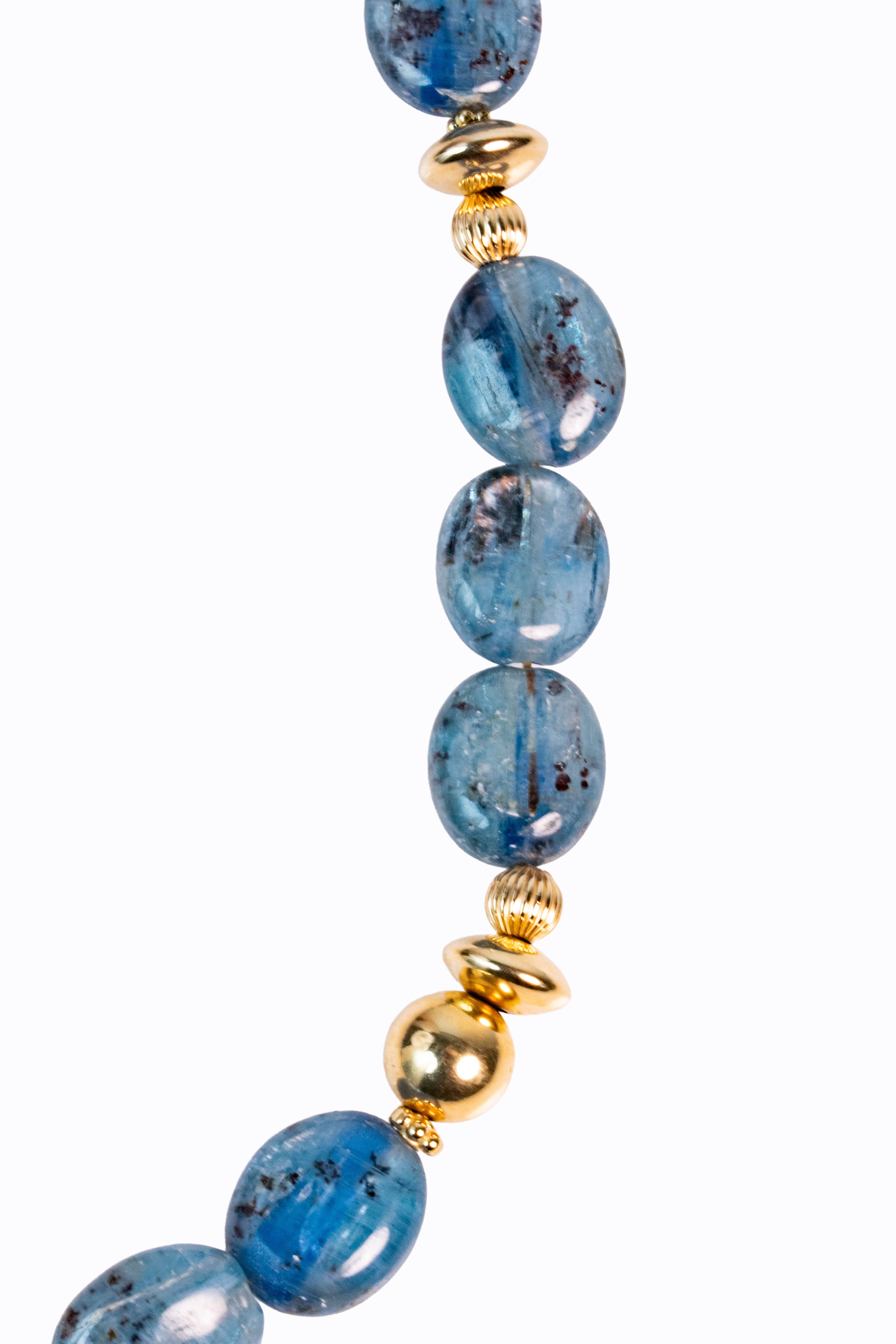 Close-up of Bondi necklace Brazilian blue kyanite smooth nuggets with 14k gold ball bead accents showing deep silicate blue color by Alexandra Essex