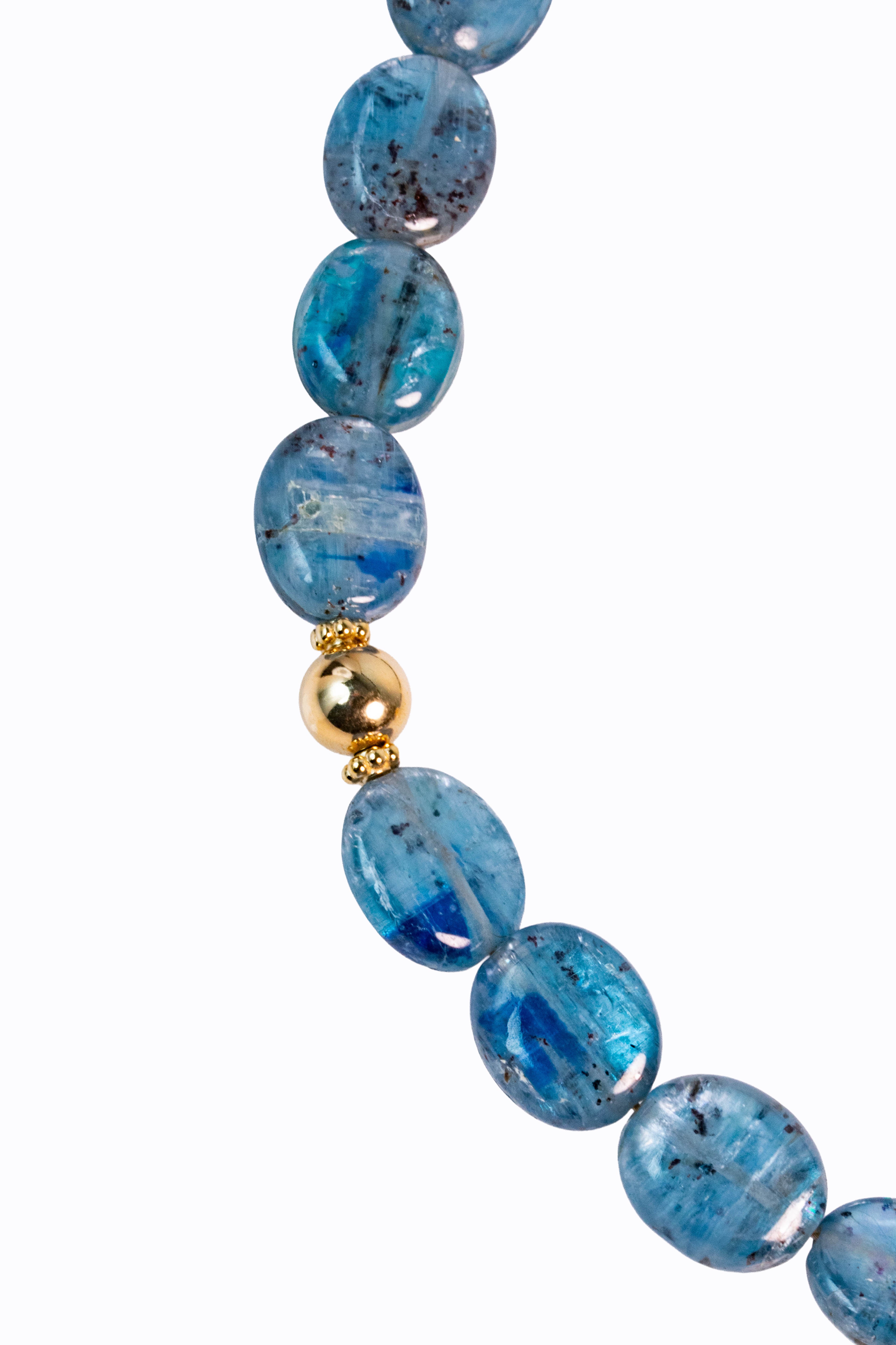 Detail of Bondi necklace Brazilian blue kyanite flat oval nuggets with directional blue color and 14k gold ball bead accent by Alexandra Essex