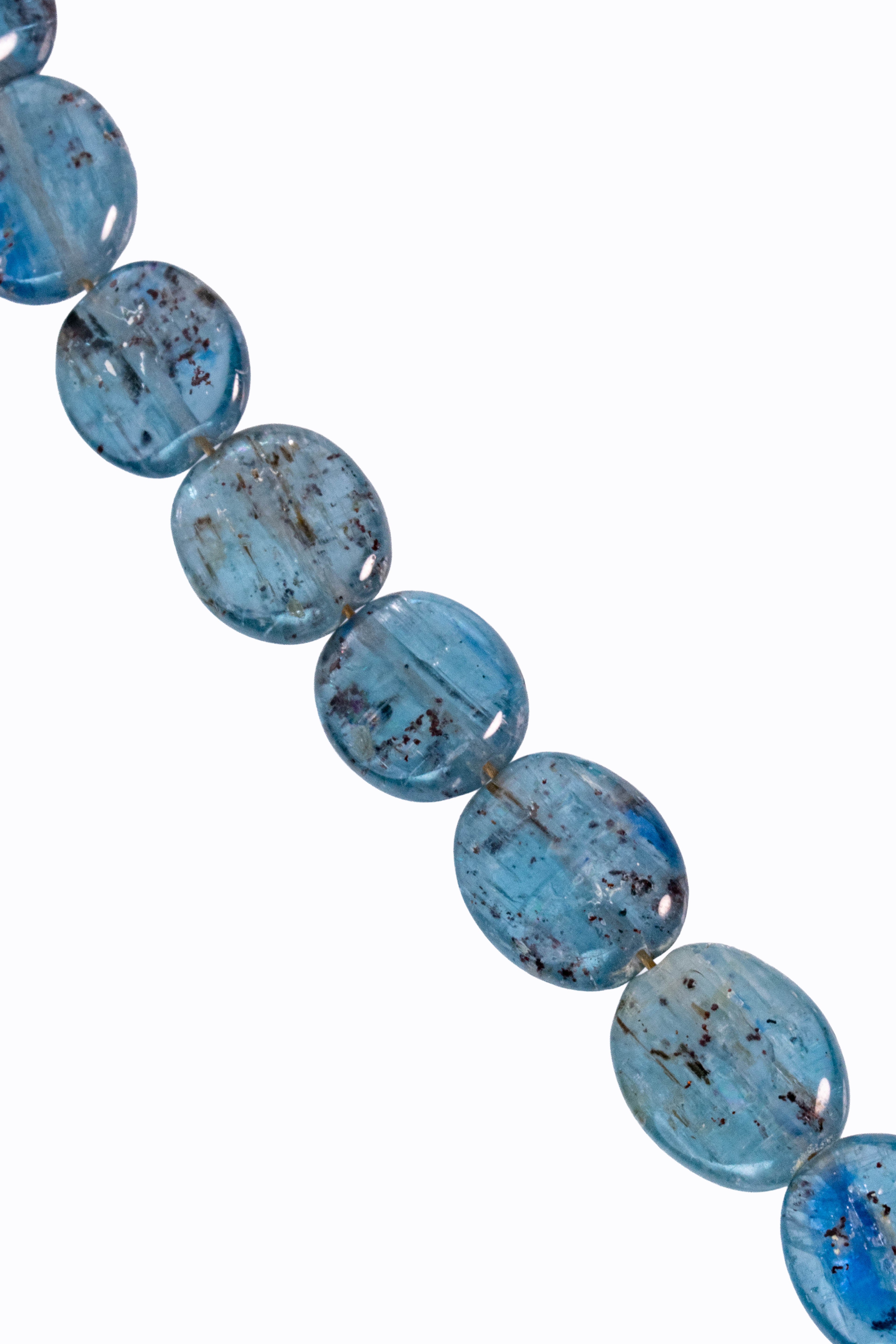 Close-up of Bondi necklace Brazilian blue kyanite smooth oval nuggets showing natural inclusions and deep directional blue silicate color by Alexandra Essex
