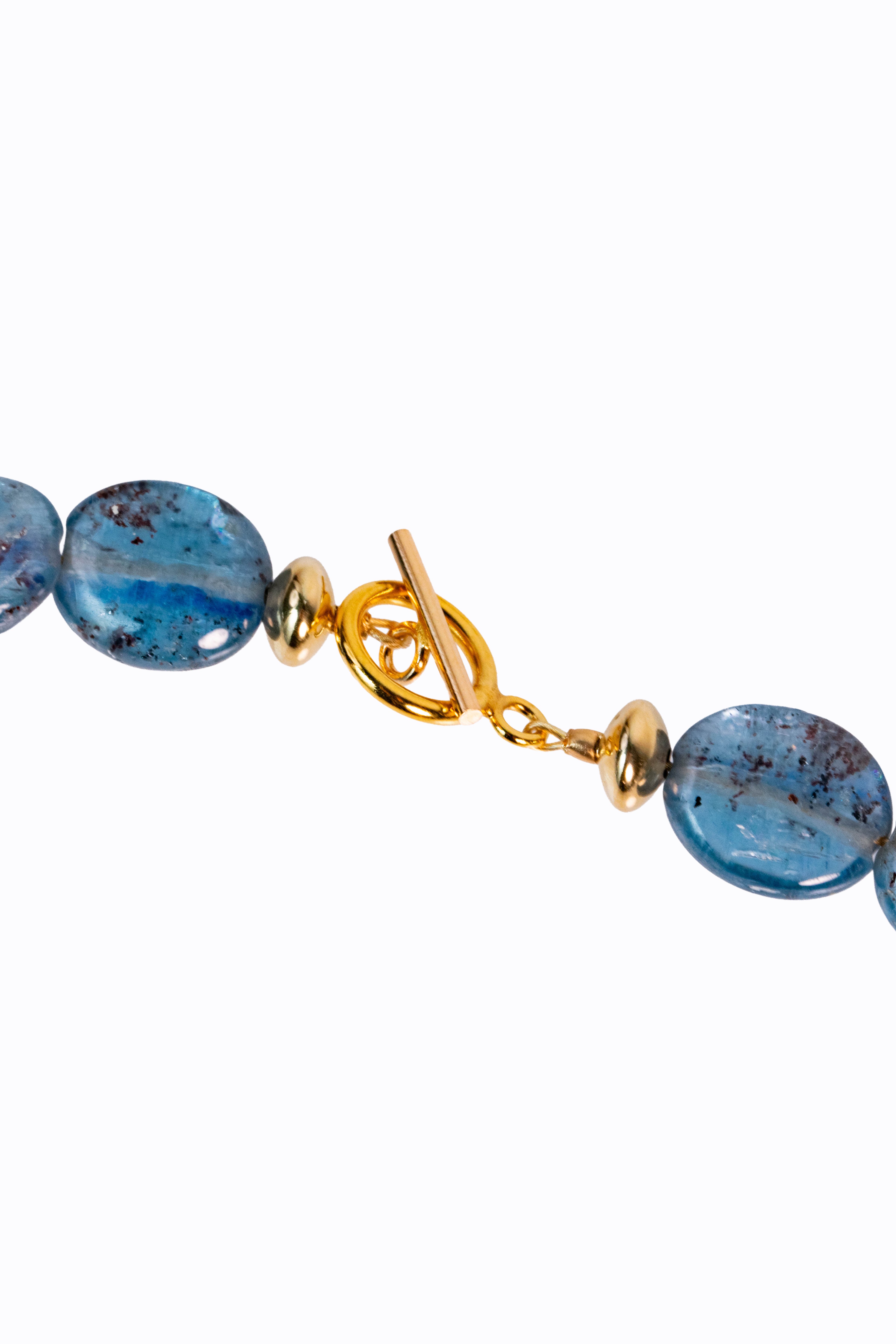 Detail of Bondi necklace 14k yellow gold toggle clasp with Brazilian blue kyanite smooth nuggets showing deep silicate blue color by Alexandra Essex