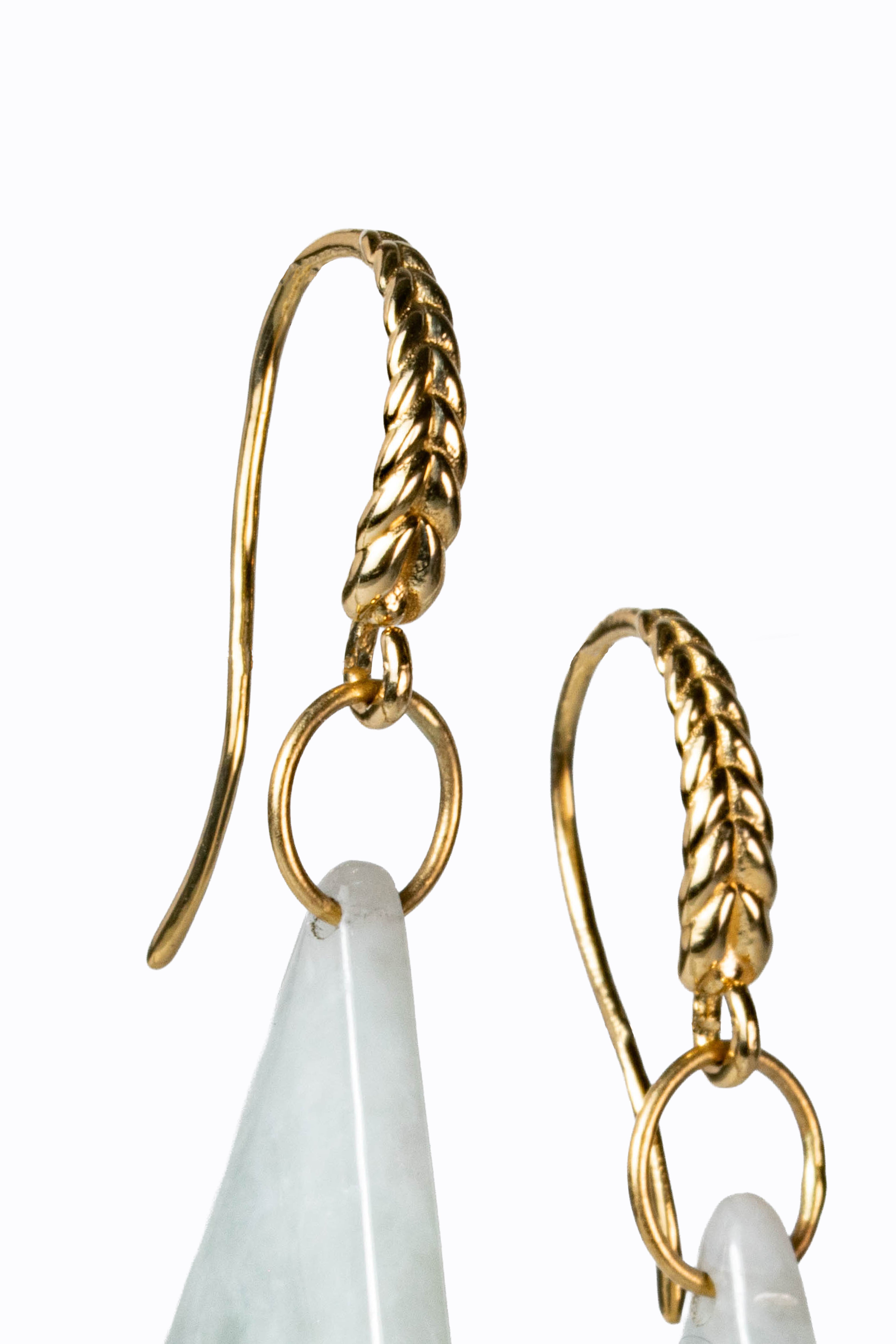 Detail of Ballina 14k yellow gold braided French hook earrings with Burmese white jade drops by Alexandra Essex
