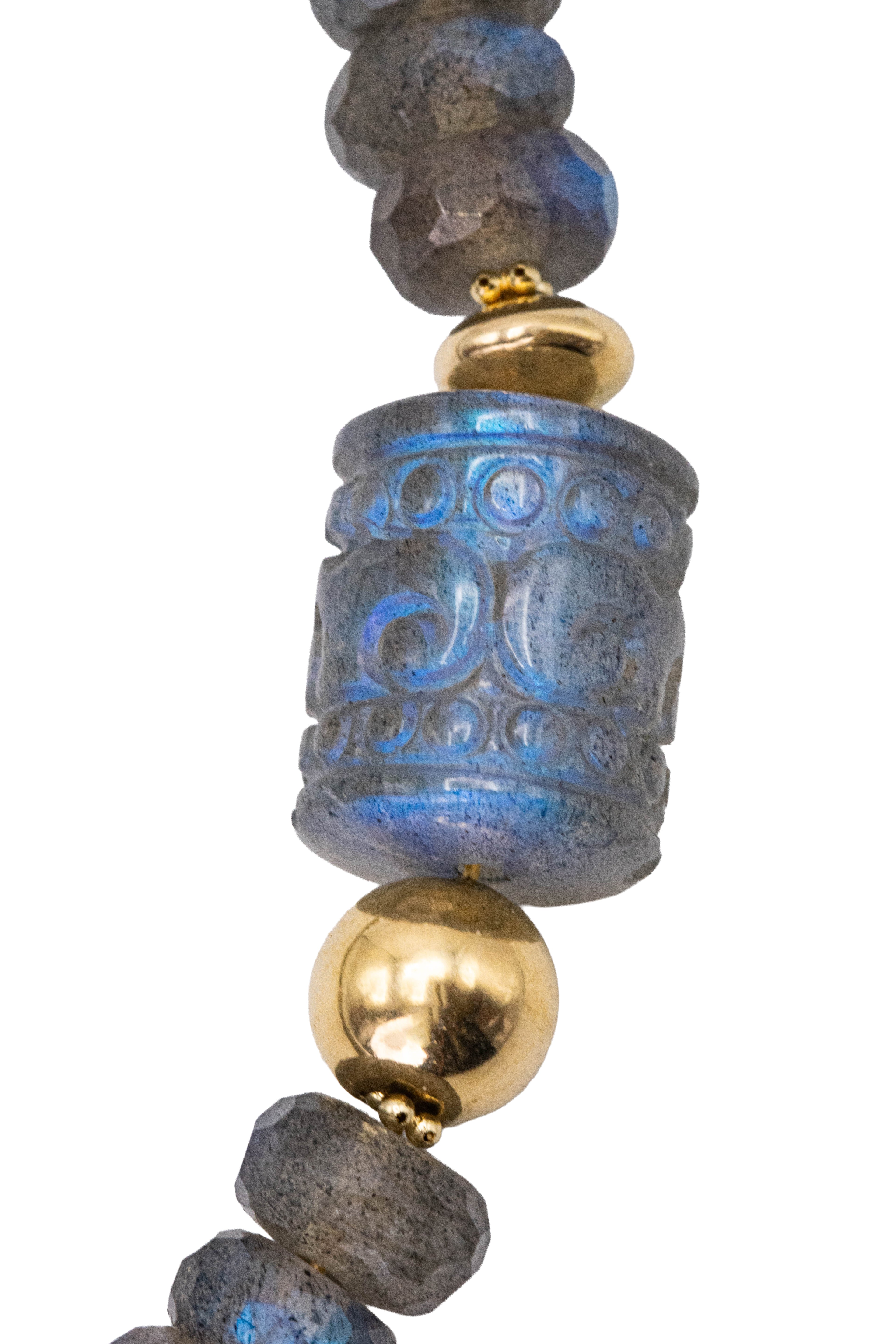 Close-up of Dusky necklace hand-carved labradorite accent bead with blue flash, 14k gold ball beads, and faceted rondelles by Alexandra Essex