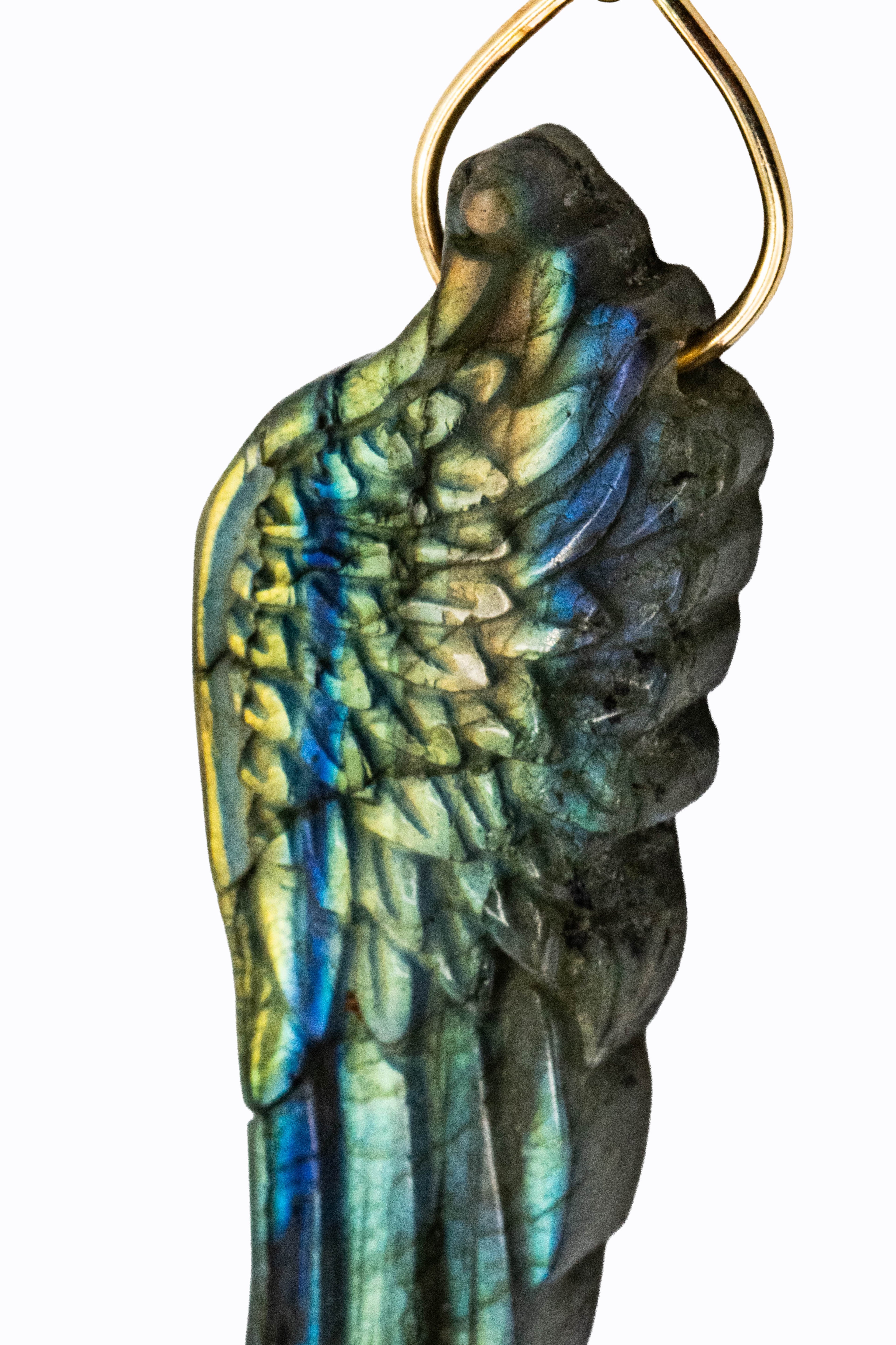 Close-up of L'Aile hand-carved labradorite wing pendant showing blue, green, and gold flash detail in 14k yellow gold by Alexandra Essex
