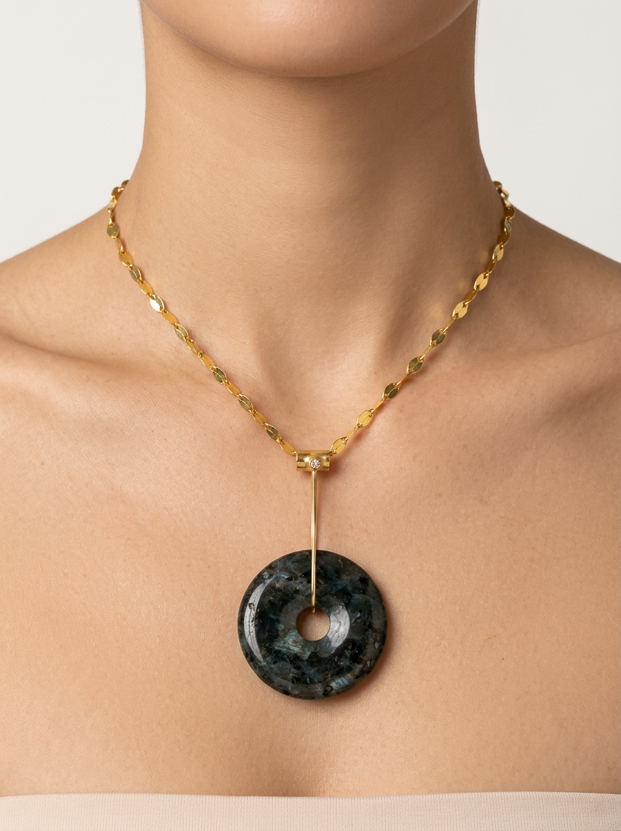 Larvikite disc pendant worn on neck with 14k gold Venetian chain by Alexandra Essex