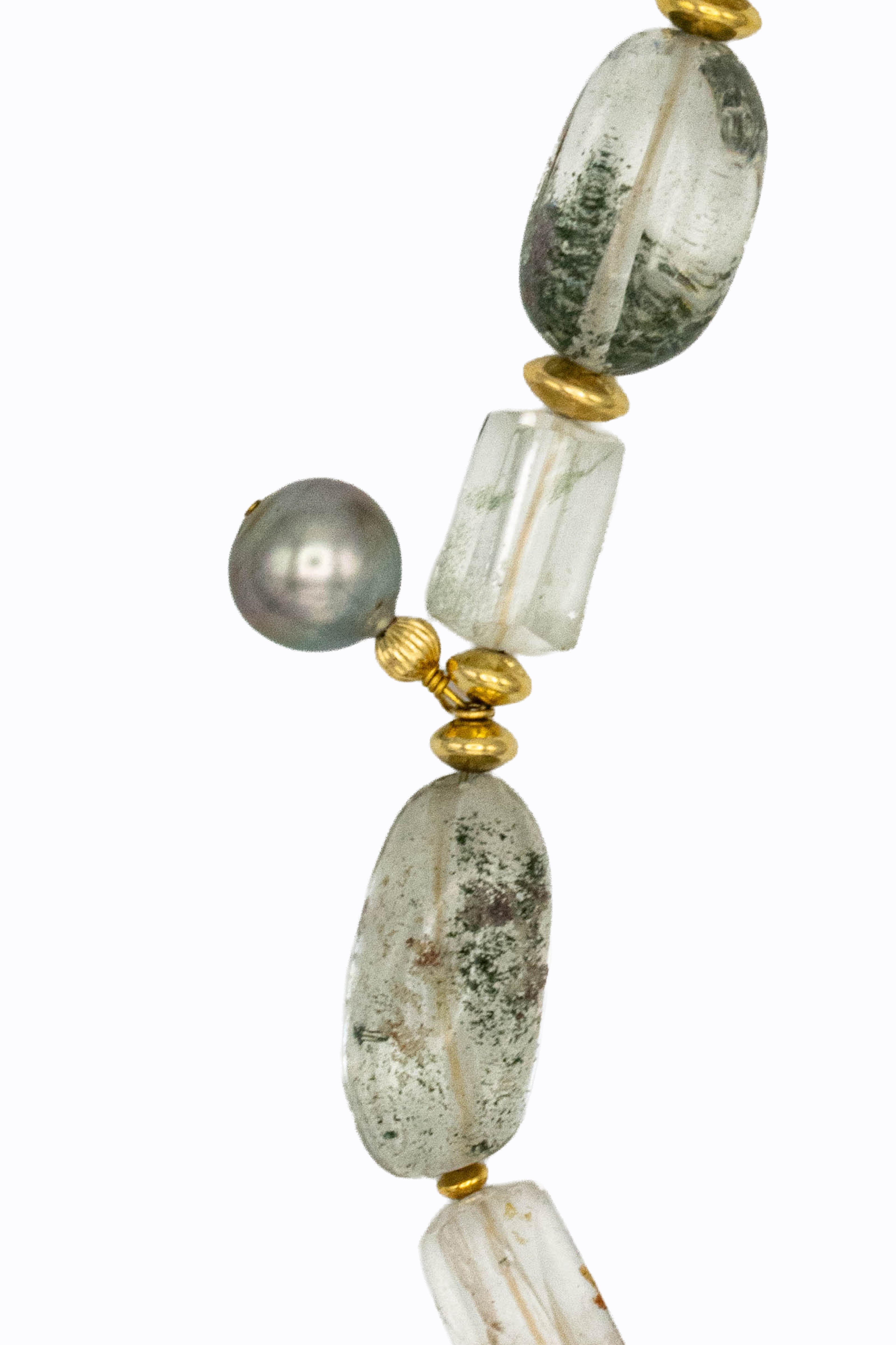 Close-up of Phantasm necklace dark grey Tahitian pearl with phantom quartz nuggets showing green ghost inclusions and 14k gold ball beads by Alexandra Essex