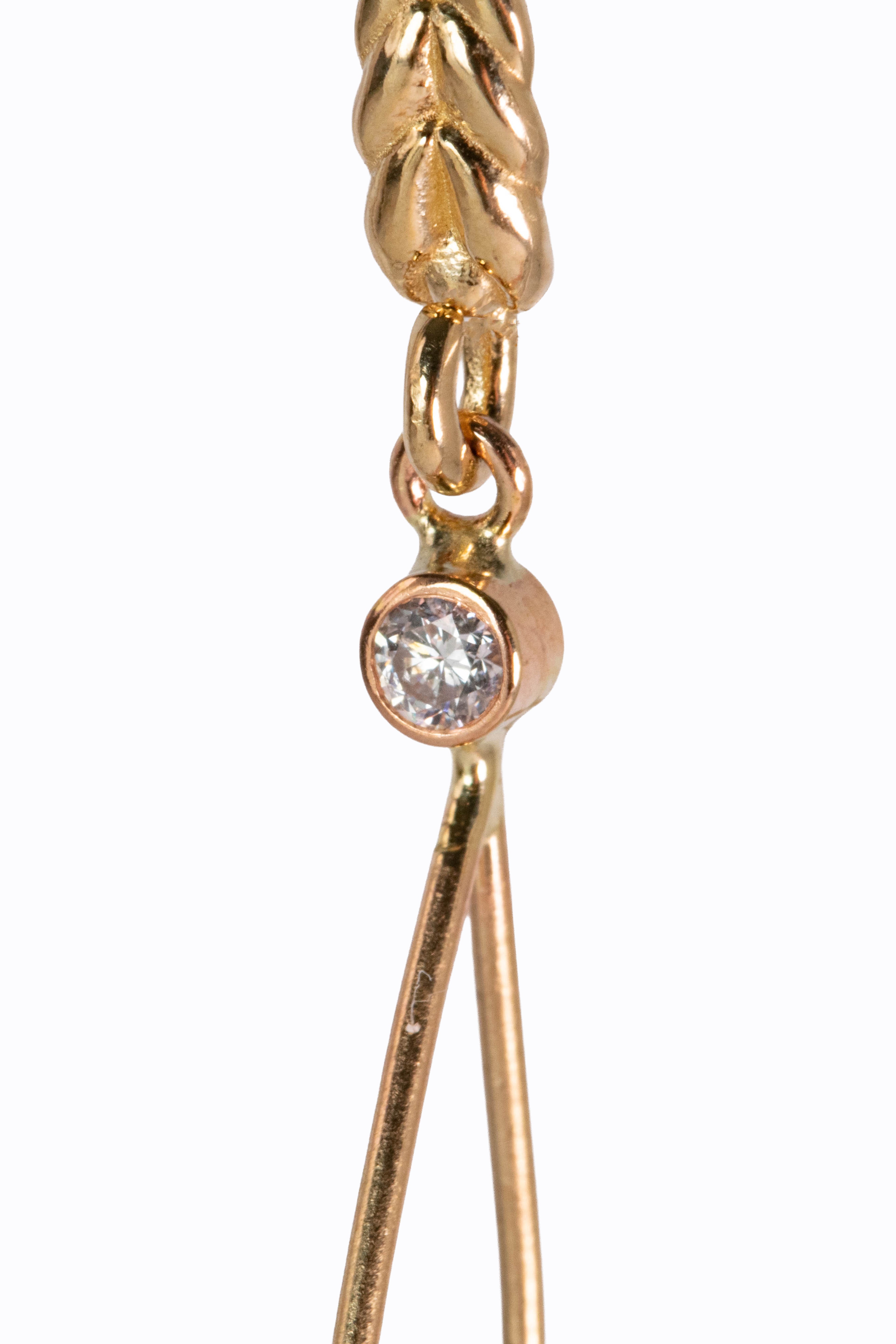 Samothrace earring macro detail showing 14k braided yellow gold hook with bezel-set diamond connector by Alexandra Essex