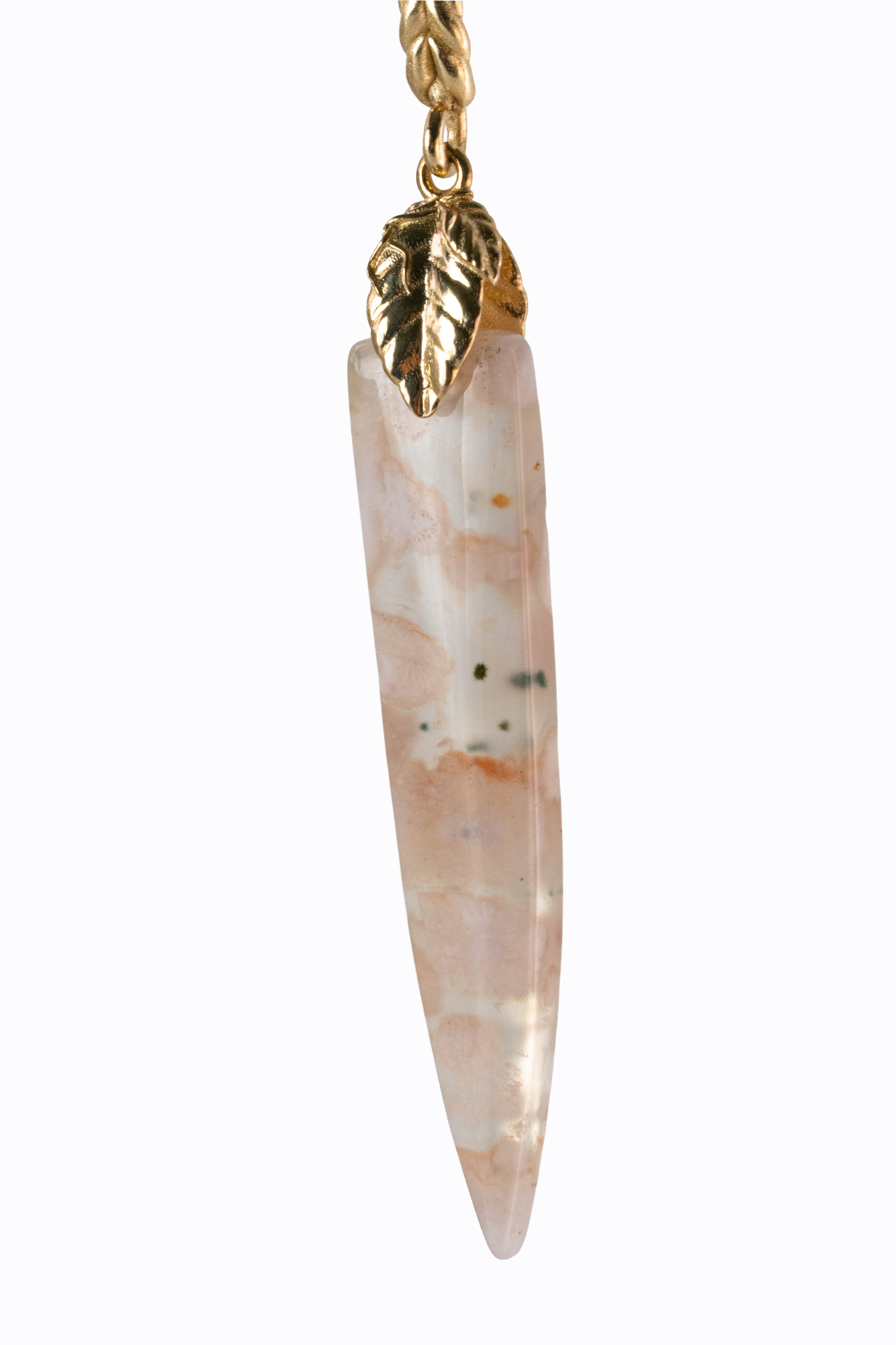 Close-up of Sakura cherry blossom agate earring showing pink and white stone pattern with 14k gold leaf detail by Alexandra Essex