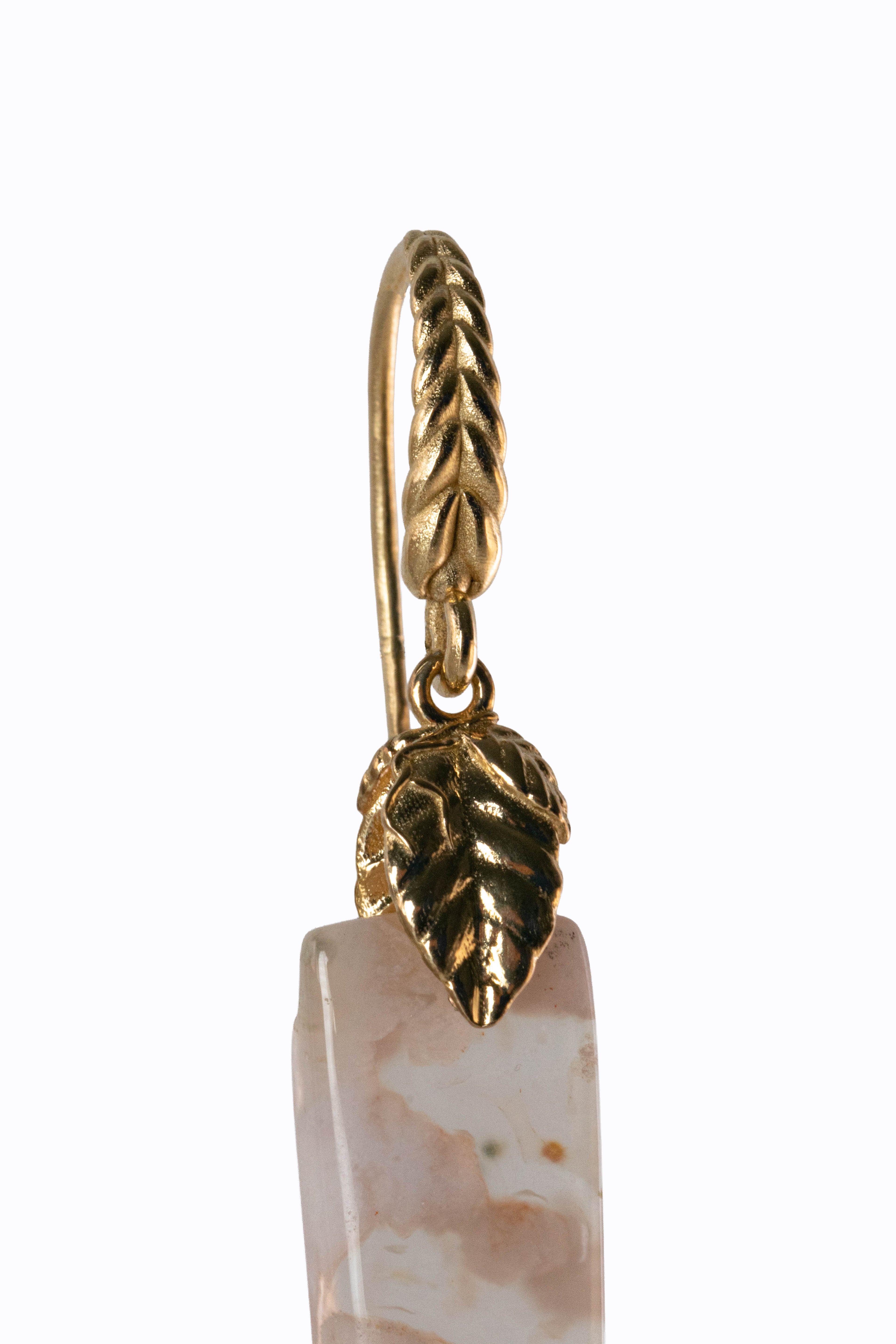 Sakura agate earring detail showing 14k yellow gold braided hook and leaf accent with cherry blossom stone by Alexandra Essex