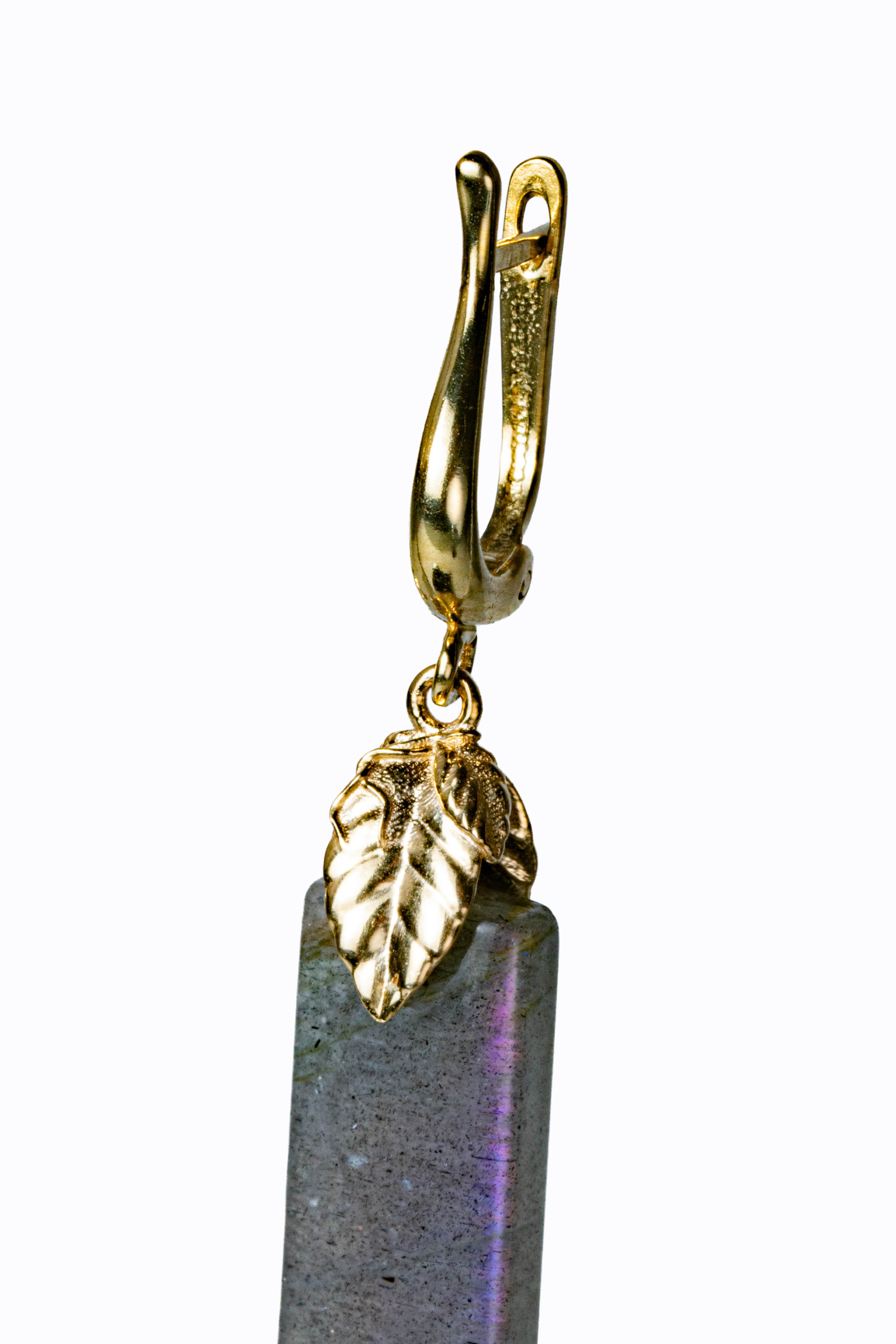 Detail of Sonrisa 14k gold leverback earring showing golden leaf accent and labradorite stone with peachy-blue flash by Alexandra Essex