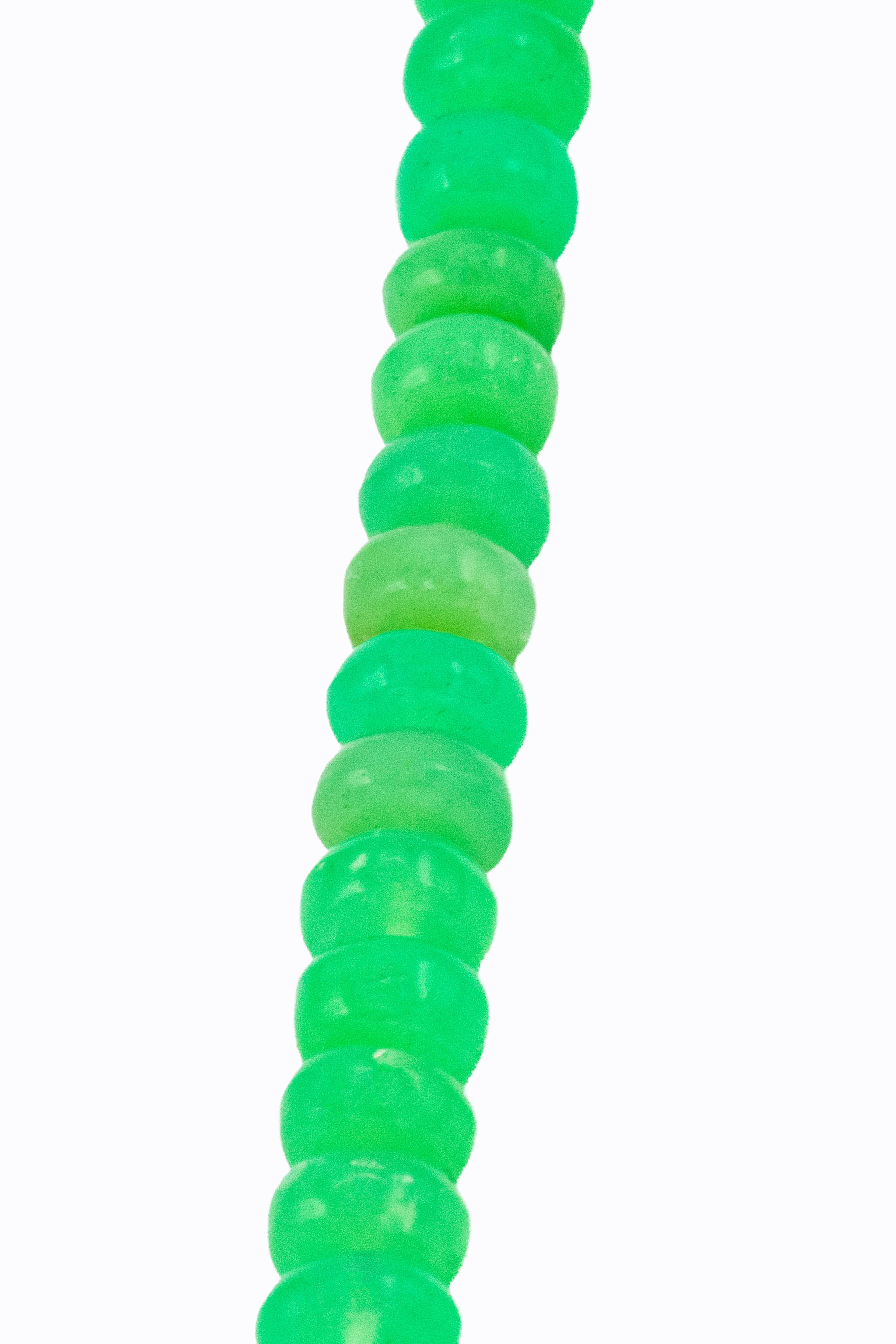 Detail of Viridi necklace Australian chrysoprase rondelles showing saturated green color and natural variation in the nickel-rich chalcedony by Alexandra Essex